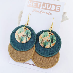 Rustic Linen Duo Dangles-Lightweight Statement Earrings- two discs of linen fabric- Pine Green + Sand coloured- with enamel painted copper embellishments with parrots- gold coloured ear wires-Hey Jude Handmade