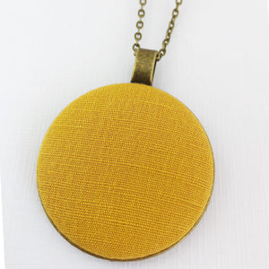 Large-Long Pendant Necklace-Antique Brass-Mustard Yellow Linen fabric feature-Bronze chain-Hey Jude Handmade