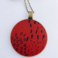 Load image into Gallery viewer, Large Long pendant necklace, brass- on bronze chain-with fabric feature- deep burgundy red with random black pattern- Hey Jude Handmade