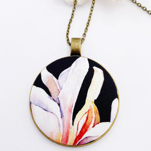 Large pendant necklace, brass-on long bronze chain- with fabric feature- white Magnolia on black- Hey Jude Handmade 